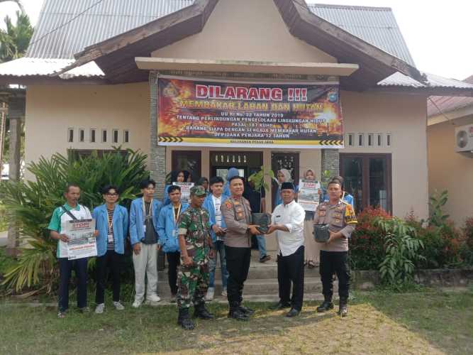 Kapolsek Tembilahan Pimpin Sosialisasi Karhutla dan Penanaman Pohon di Pekan Arba