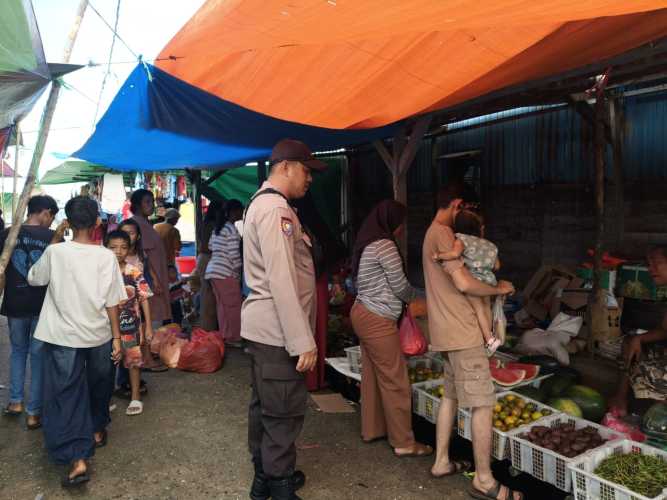 Bhabinkamtibmas Sambangi Pasar Desa Sungai Bela, Himbauan Kamtibmas Disampaikan
