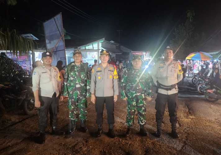 Kapolsek Kempas dan Danramil 07 Tempuling Turun Langsung Amankan Kampanye di Kempas Jaya.