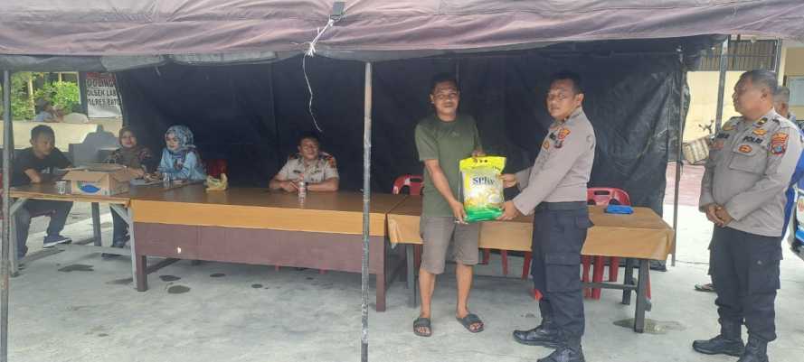 Kapolsek Labuhan Ruku Gelar Gerakan Pangan Murah: Ratusan Karung Beras dan Minyak Kita Habis Terjual dalam Sehari