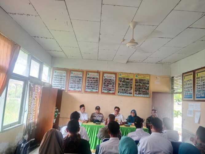 Bripka Ade Putra Wakili Kapolsek Kuindra dalam Persiapan Jambore PKK dan STQ Tingkat Kecamatan